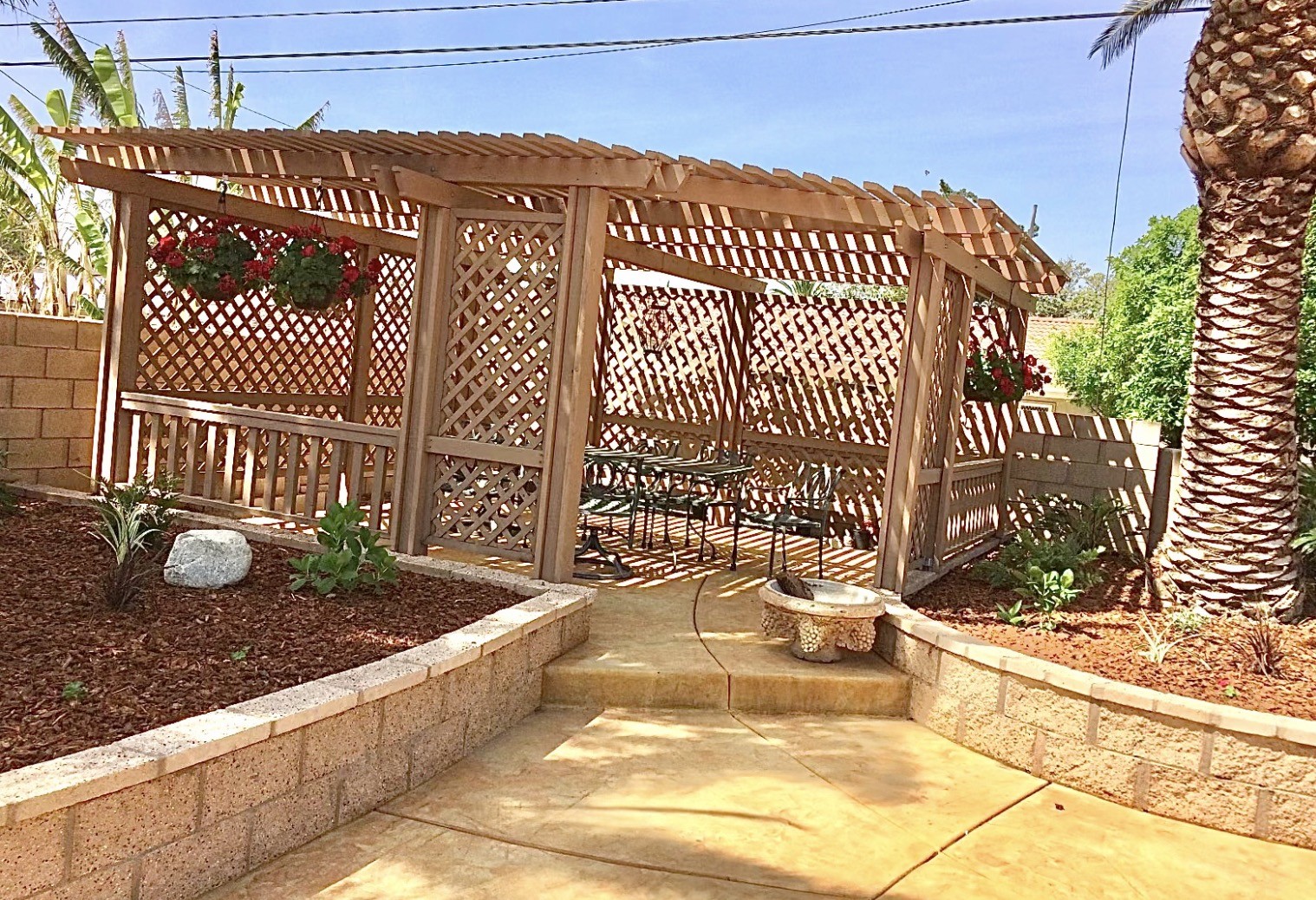 Finished cedar pergola with privacy lattice and seating