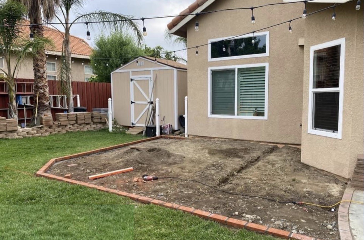 Rialto backyard before — bare patio pad