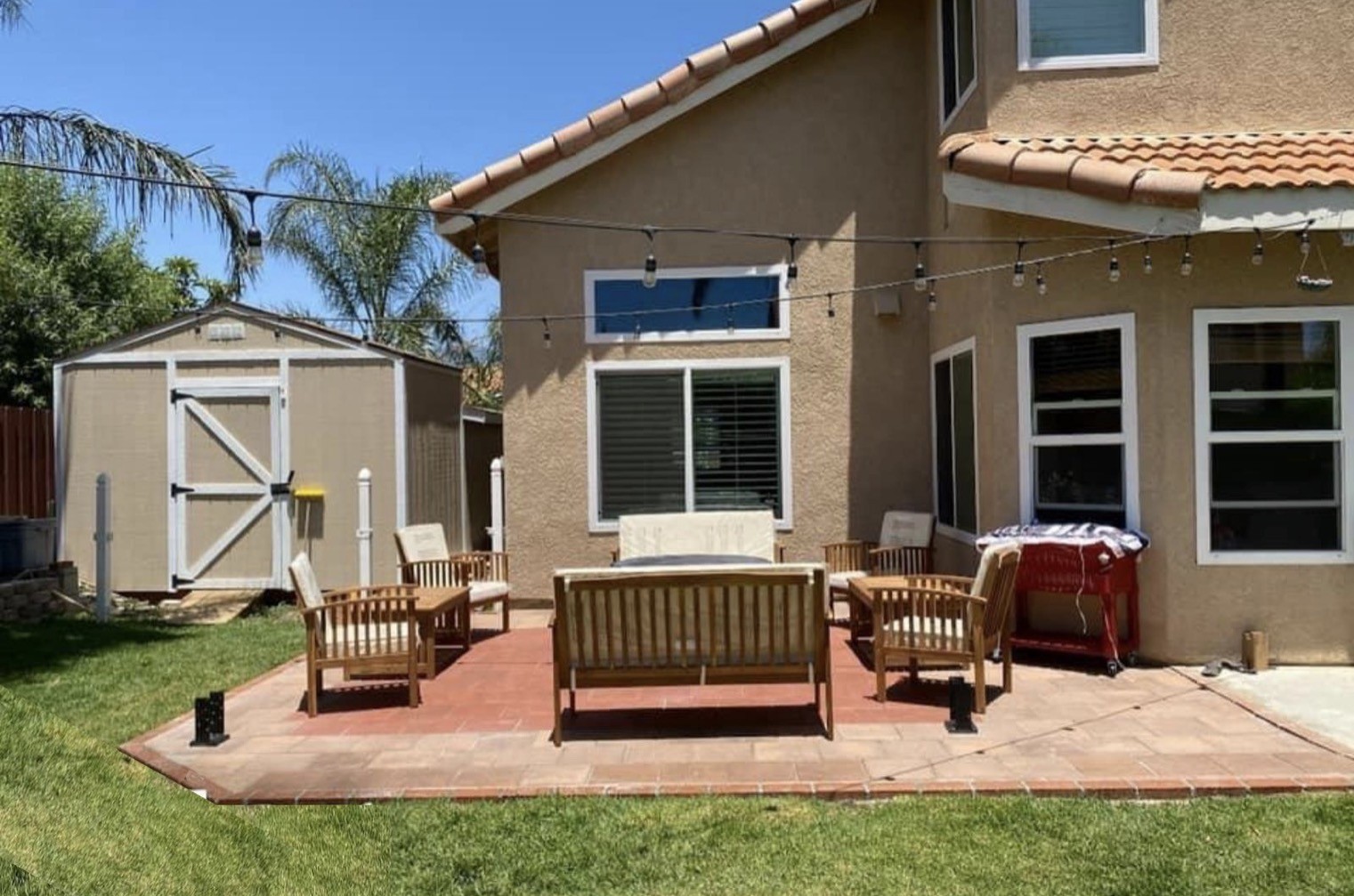 Finished paver patio with outdoor furniture